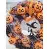 Boszis halloweeni ajtódísz világító tökfejekkel